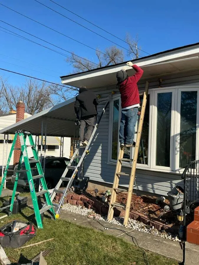 Restoration crew performing exterior repair in International Falls
